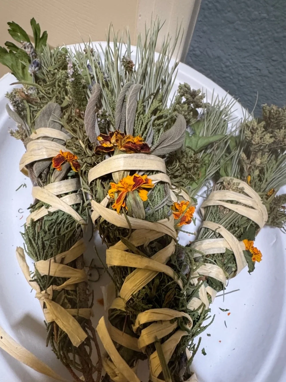 Hand-Tied organic Sage and Herb Smudge Bundle with Marigolds. Smoke medicine!